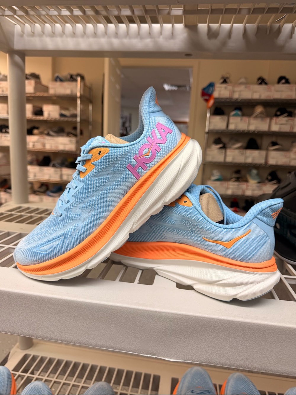 Hoka Women's Sky Blue Athletic Sneakers with Orange Trim